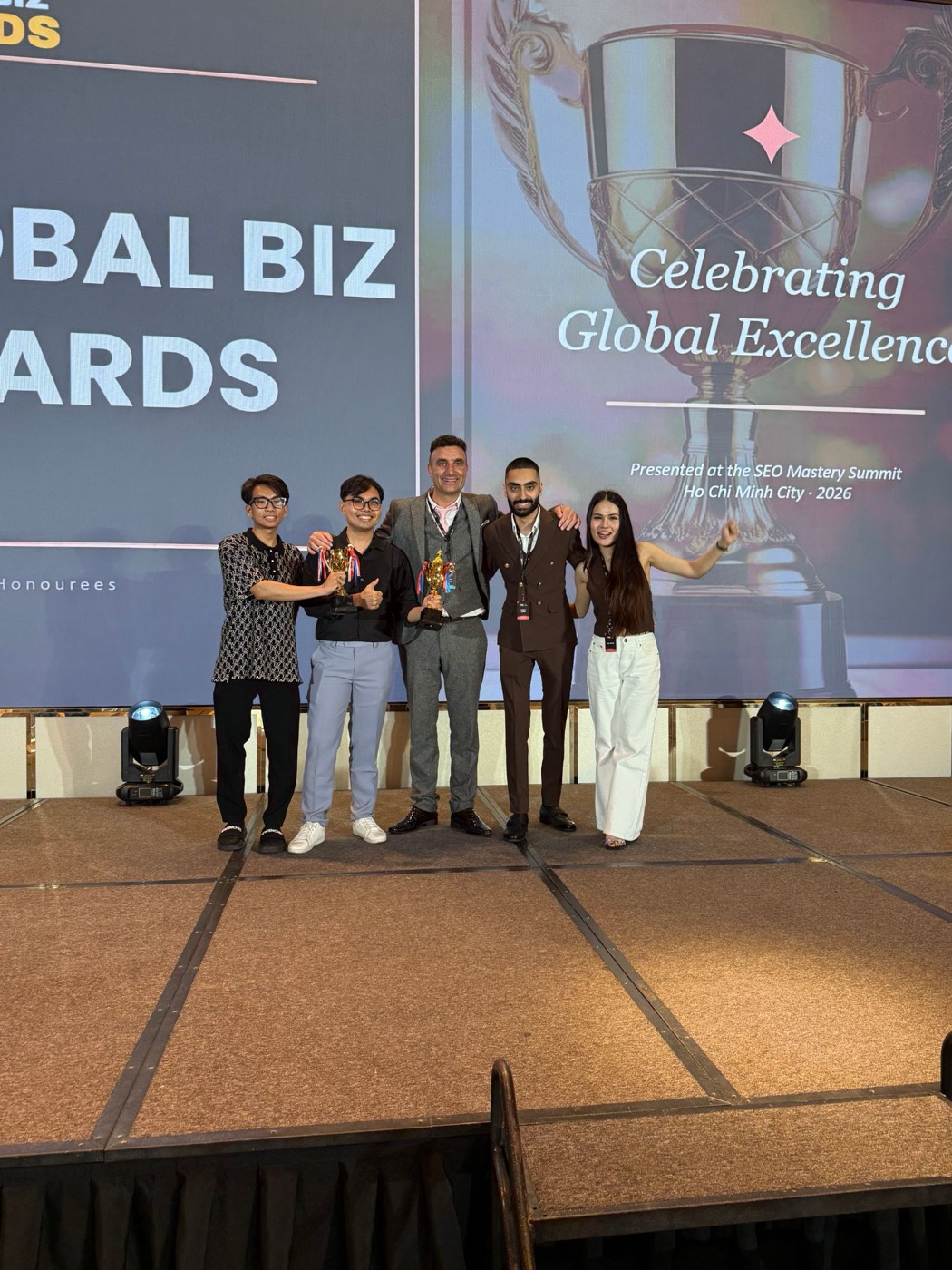 The mySEO team on stage with the Best SEO App trophies at the Global Biz Awards, SEO Mastery Summit 2026, Ho Chi Minh City